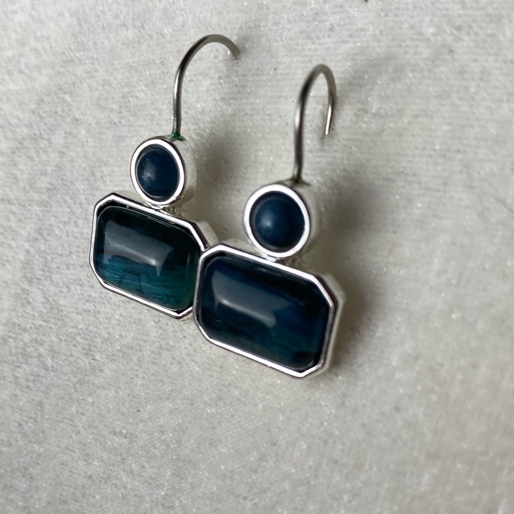 Silver earrings.